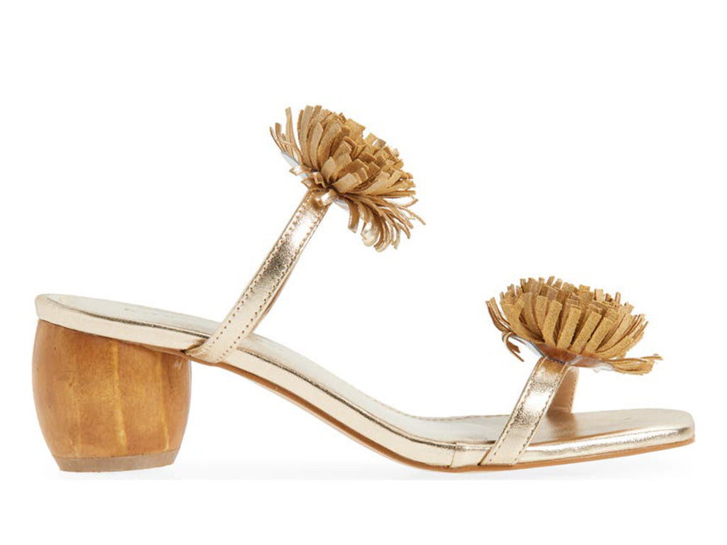 gold metallic sandal with pom-pom details on a cylindrical block heel - side view