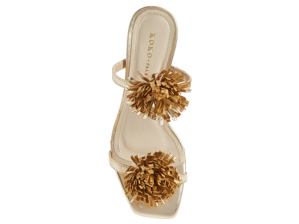 gold metallic sandal with pom-pom details on a cylindrical block heel - top view