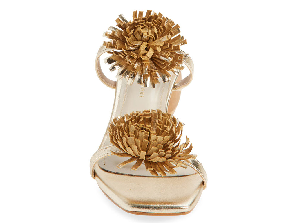 gold metallic sandal with pom-pom details on a cylindrical block heel - front view