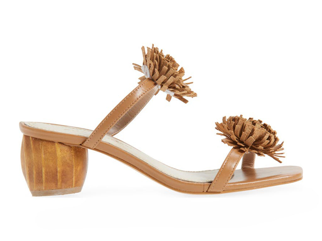Brown sandal with pom-pom details on a cylindrical block heel - side view