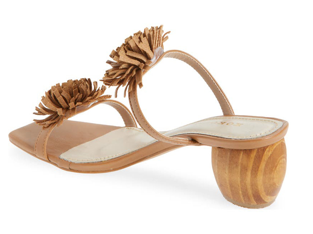 Brown sandal with pom-pom details on a cylindrical block heel - back angle view