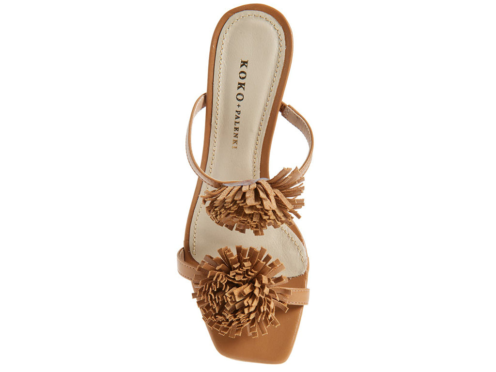 Brown sandal with pom-pom details on a cylindrical block heel - top view