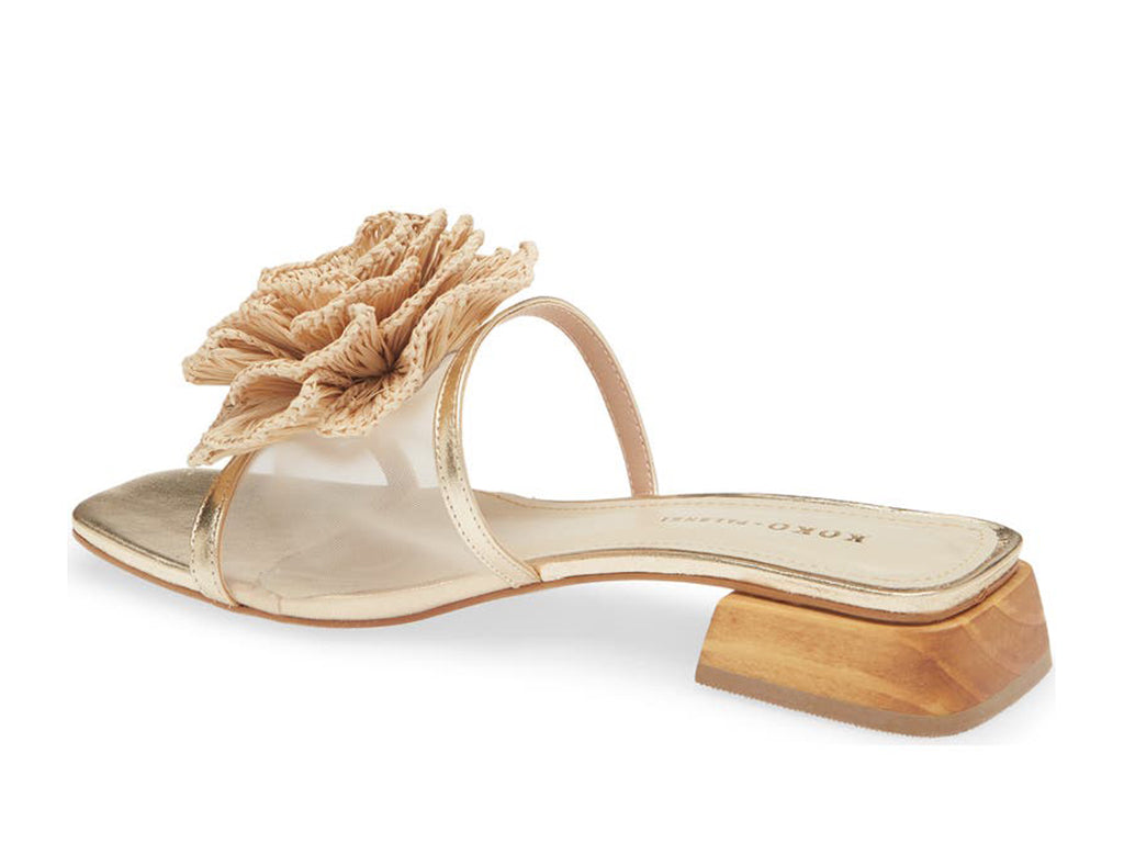 Gold sandal with nylon upper and a raffia floral detail - view from the back angle