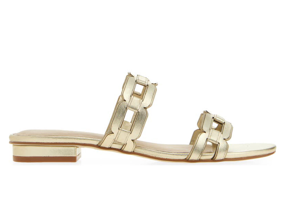gold sandal with strap details on a low heel- side view