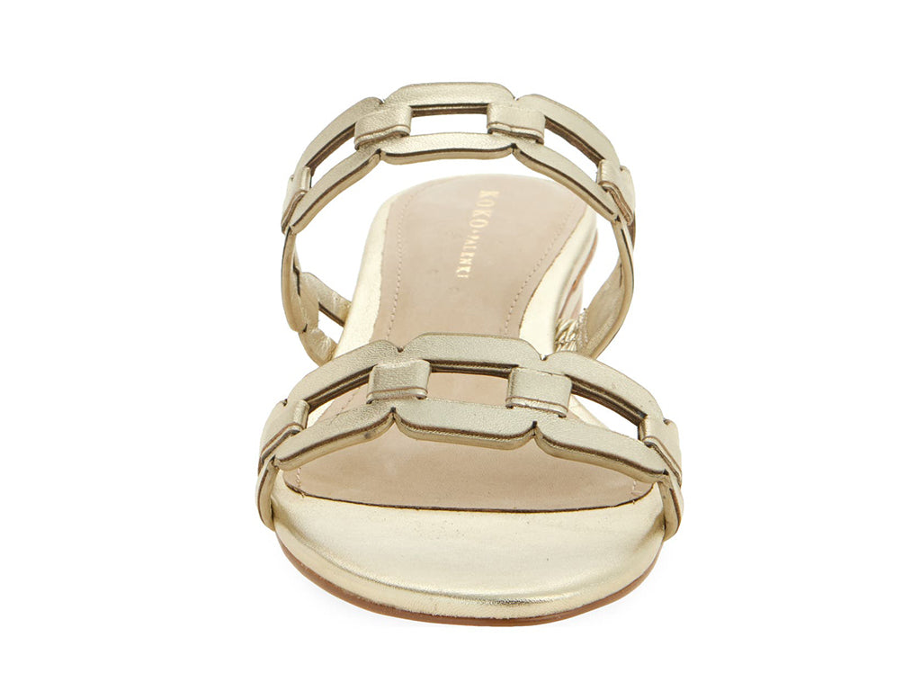 gold sandal with strap details on a low heel- front view of toe opening