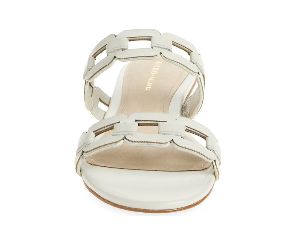 White sandal with strap details - front view of toe opening