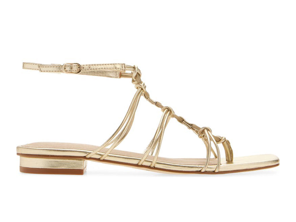 Gold strappy sandal with ankle strap and low heel
