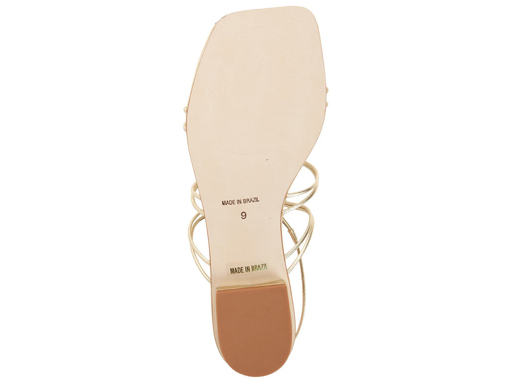 view of the outsole of a sandal with 'Made in Brazil' label 
