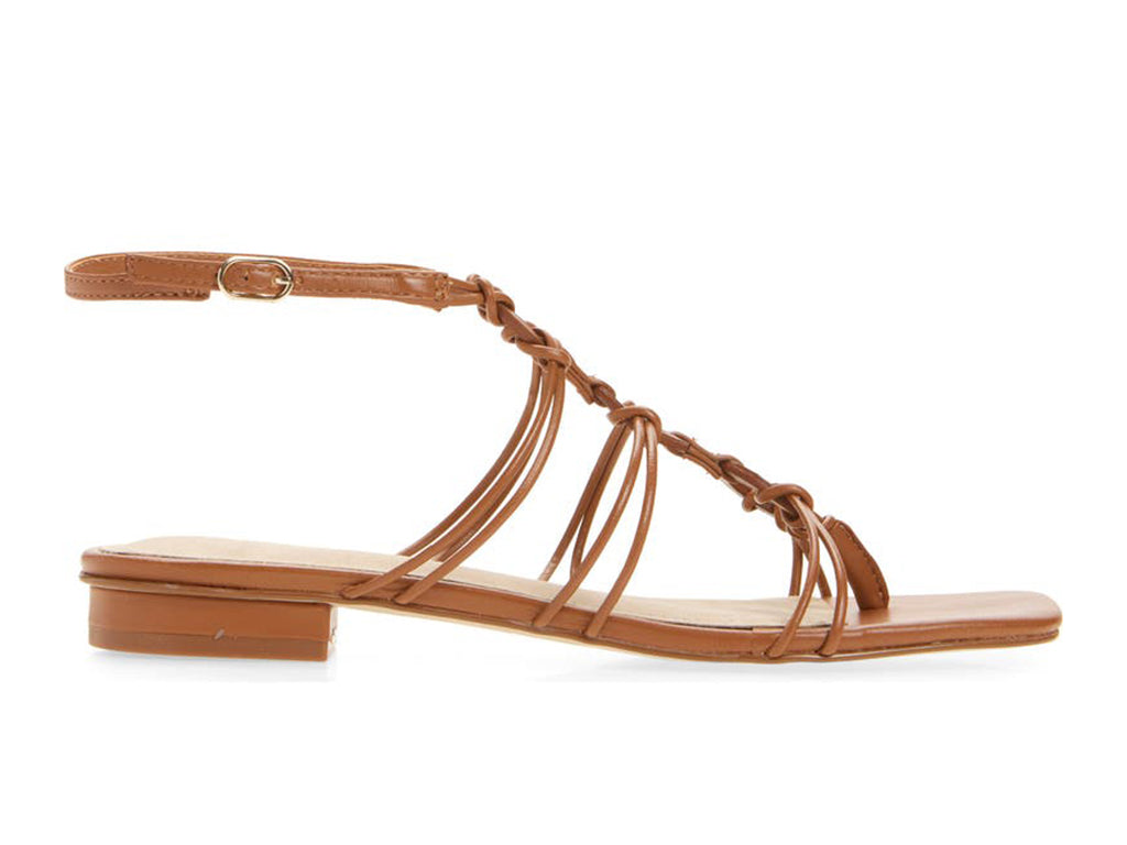 tan colored sandal with thin straps, ankle strap, and low heel, side view