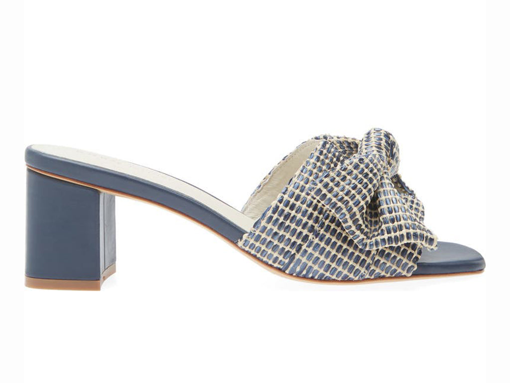 navy raffia block heel sandal with over size bow - view of the side of the shoe