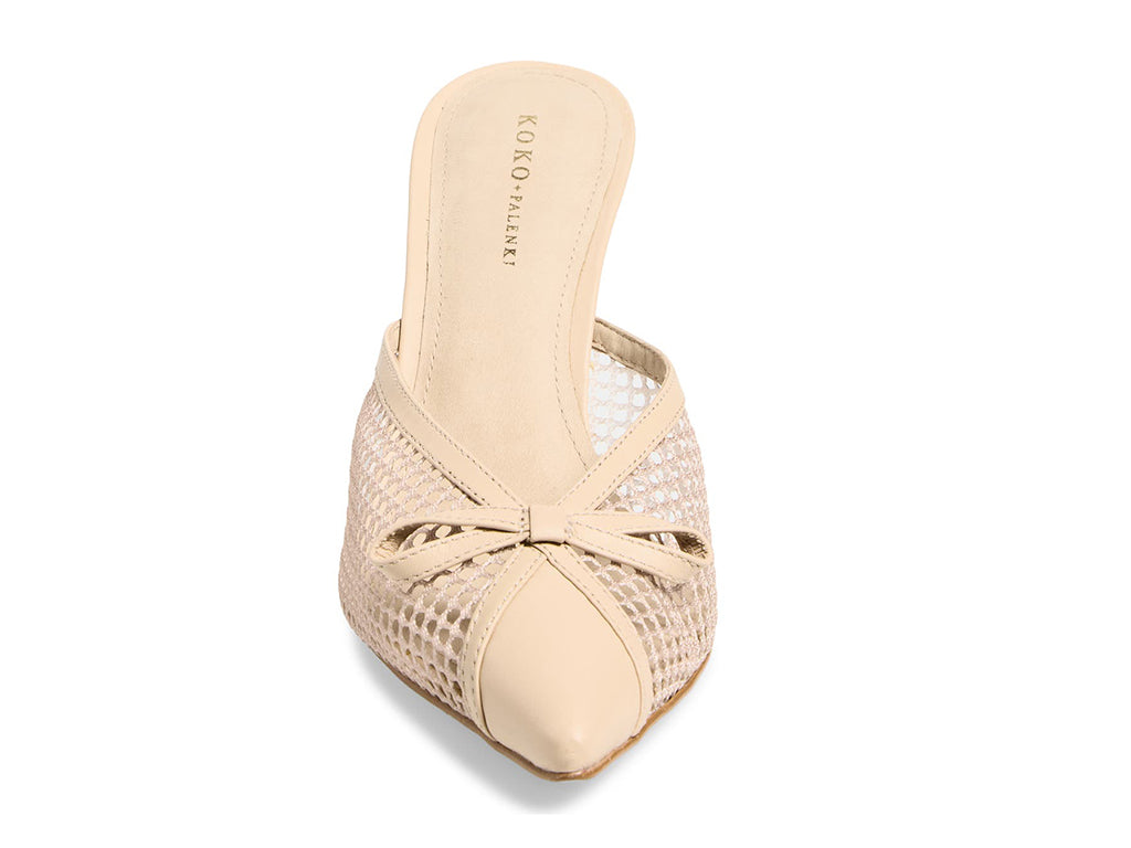 Beige mid-heeled shoe with mesh design - front view of the pointy toe and upper with mesh and bow