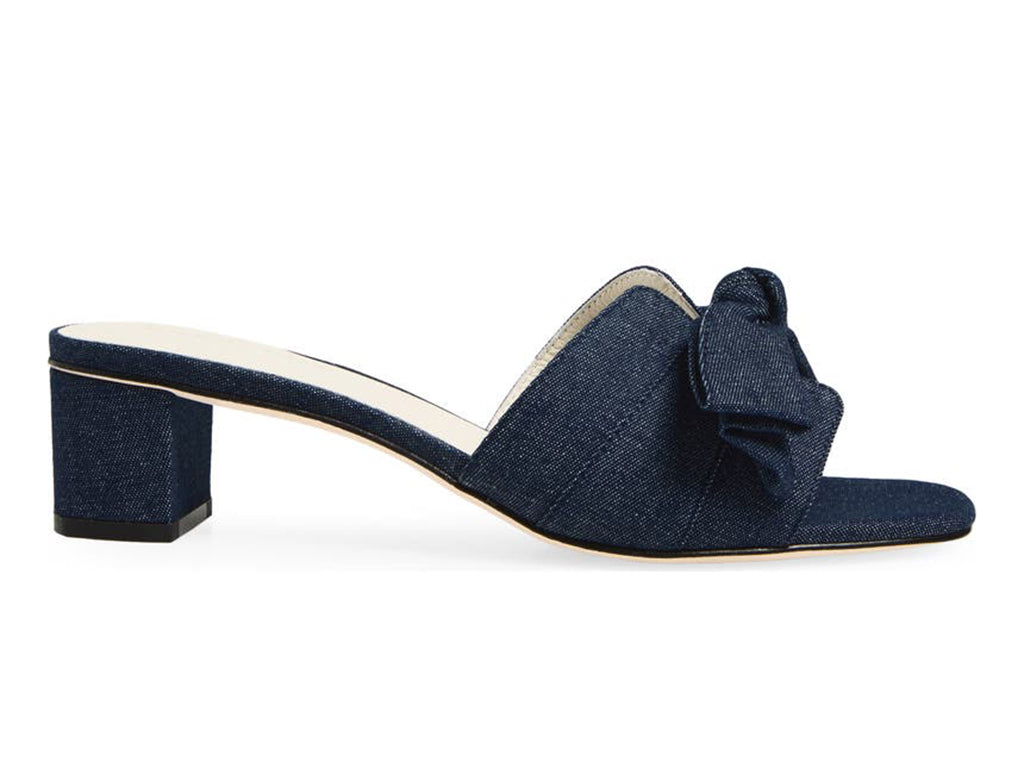 Blue denim slide sandal with a bow and block heel - side view