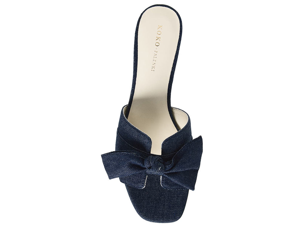 Blue denim slide sandal with a bow - top view of upper and square toe